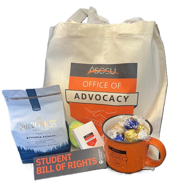 A mug, bag, and coffee beans